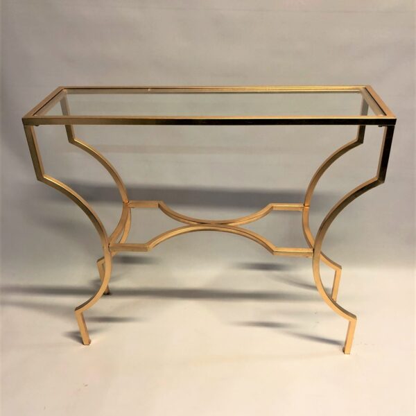 Zelta krāsas metāla konsole ar stikla virsmu.