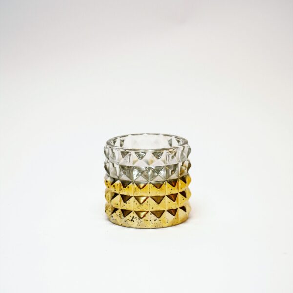 Zeltīts stikla svečturis